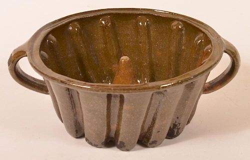 ANTIQUE GREEN GLAZED EARTHENWARE