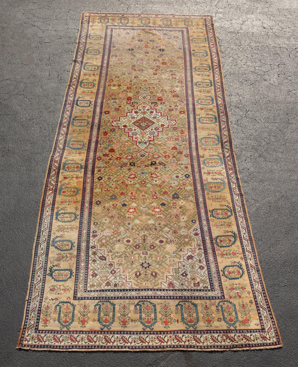 ANTIQUE HAND KNOTTED CAUCASIAN RUG,