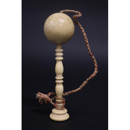 Antique ivory ball on turned