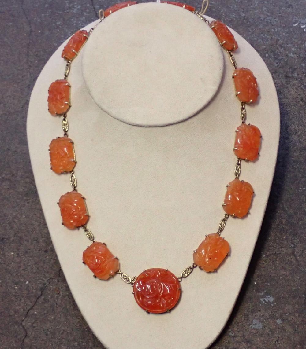 ANTIQUE ORANGE JADE AND GOLD