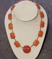 ANTIQUE ORANGE JADE AND GOLD N