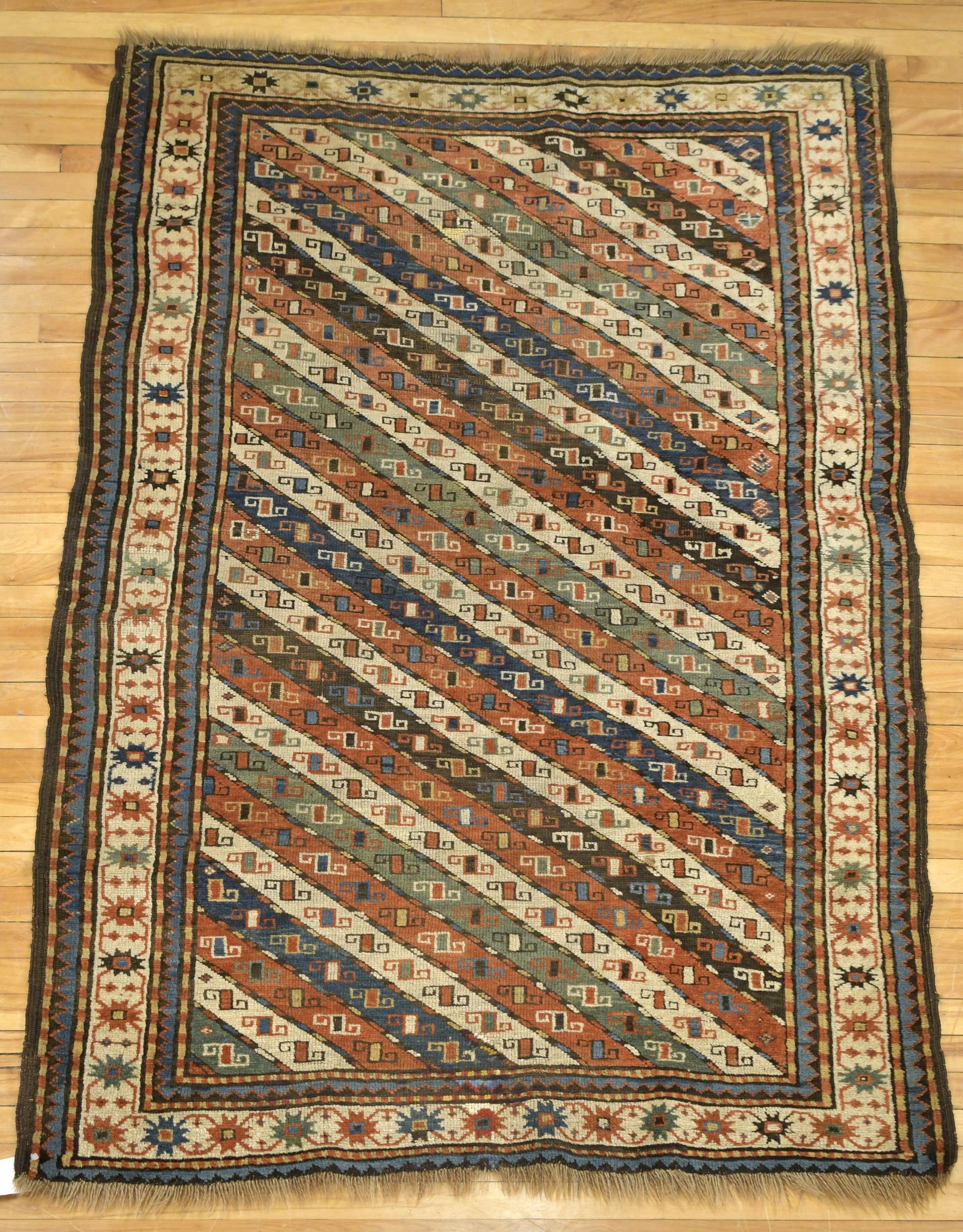 ANTIQUE ORIENTAL KAZAK AREA RUG. An
