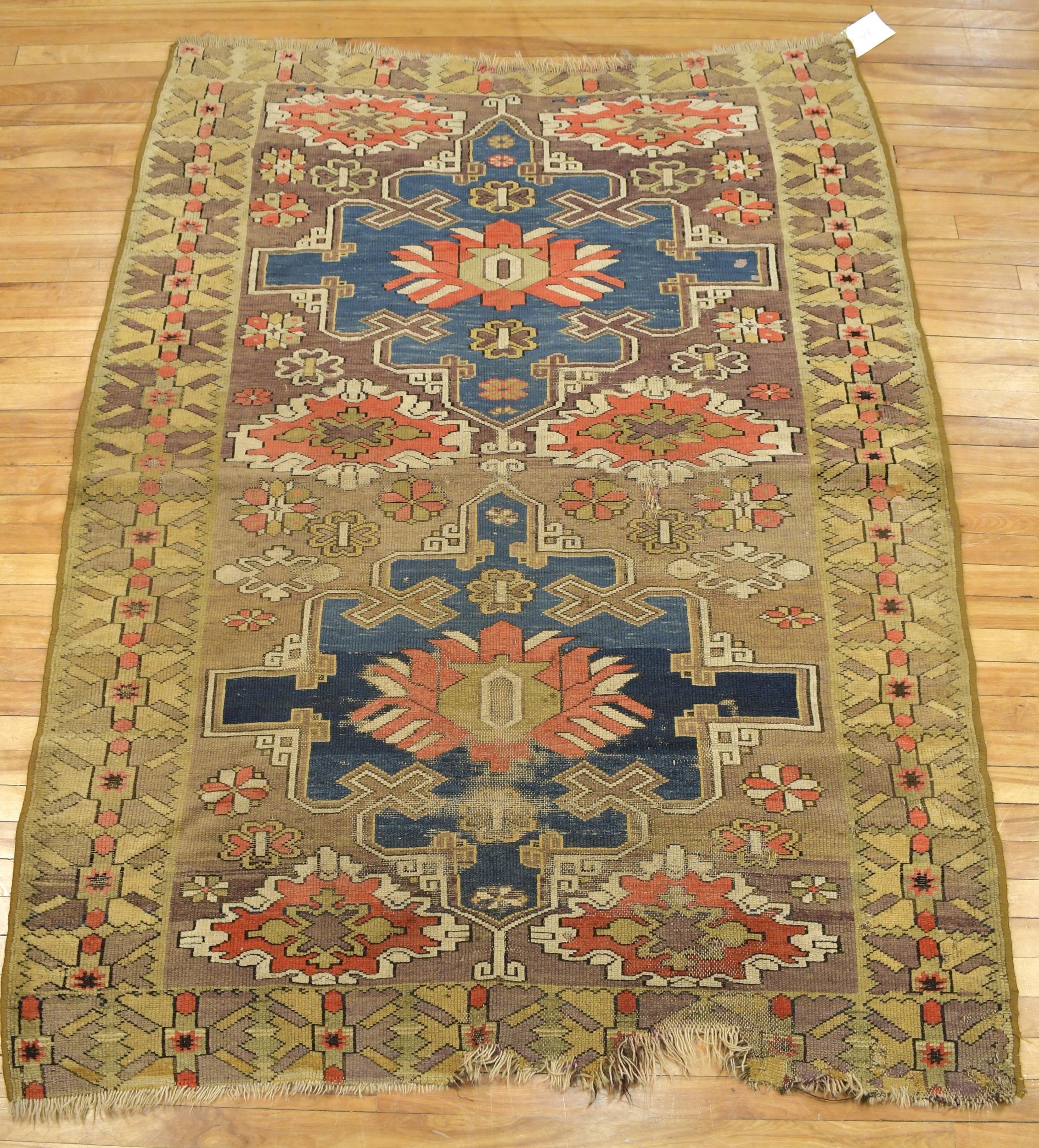 ANTIQUE ORIENTAL KAZAK SCATTER RUG.