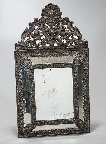 Antique repousse brass wall mirror,