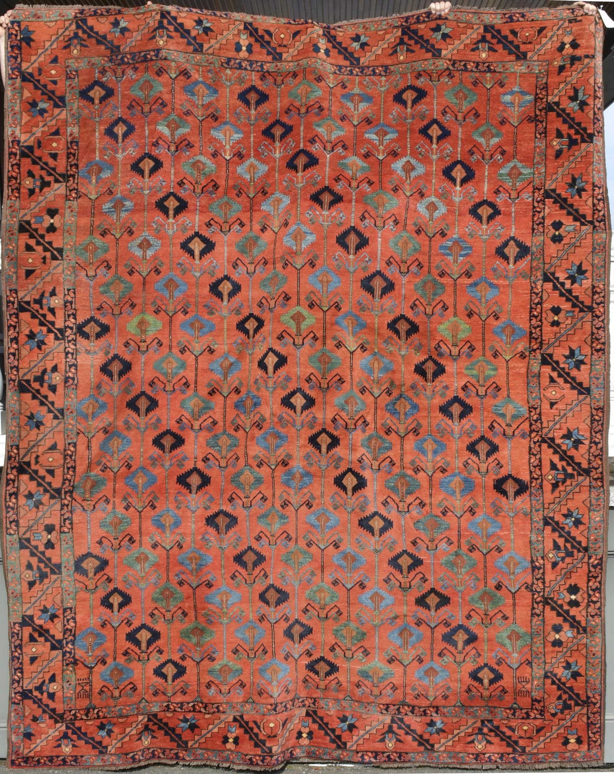 ANTIQUE ROOM SIZE ORIENTAL RUG.