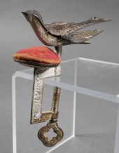 ANTIQUE SEWING BIRD WITH PIN C