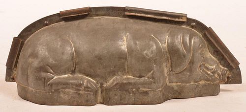 ANTIQUE TIN RECLINING PIG FORM