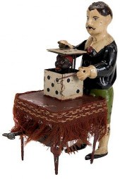 ANTIQUE WIND-UP MAGICIAN TOY.A