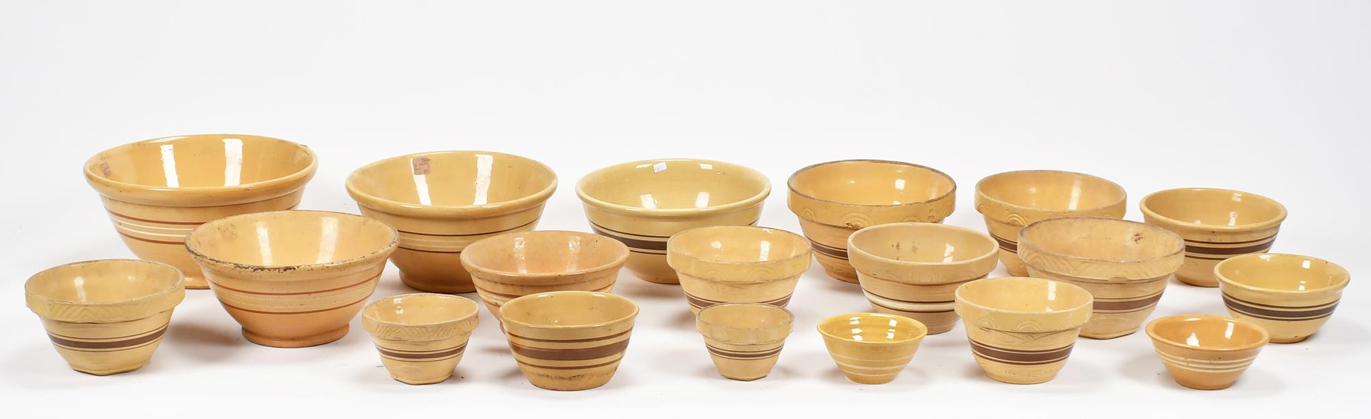 ANTIQUE YELLOW WARE BOWLS. Group of
