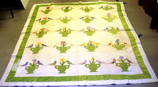 Applique quilt with bird and flower