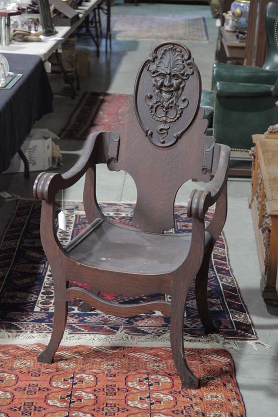 ARMCHAIR. Oak having a carved