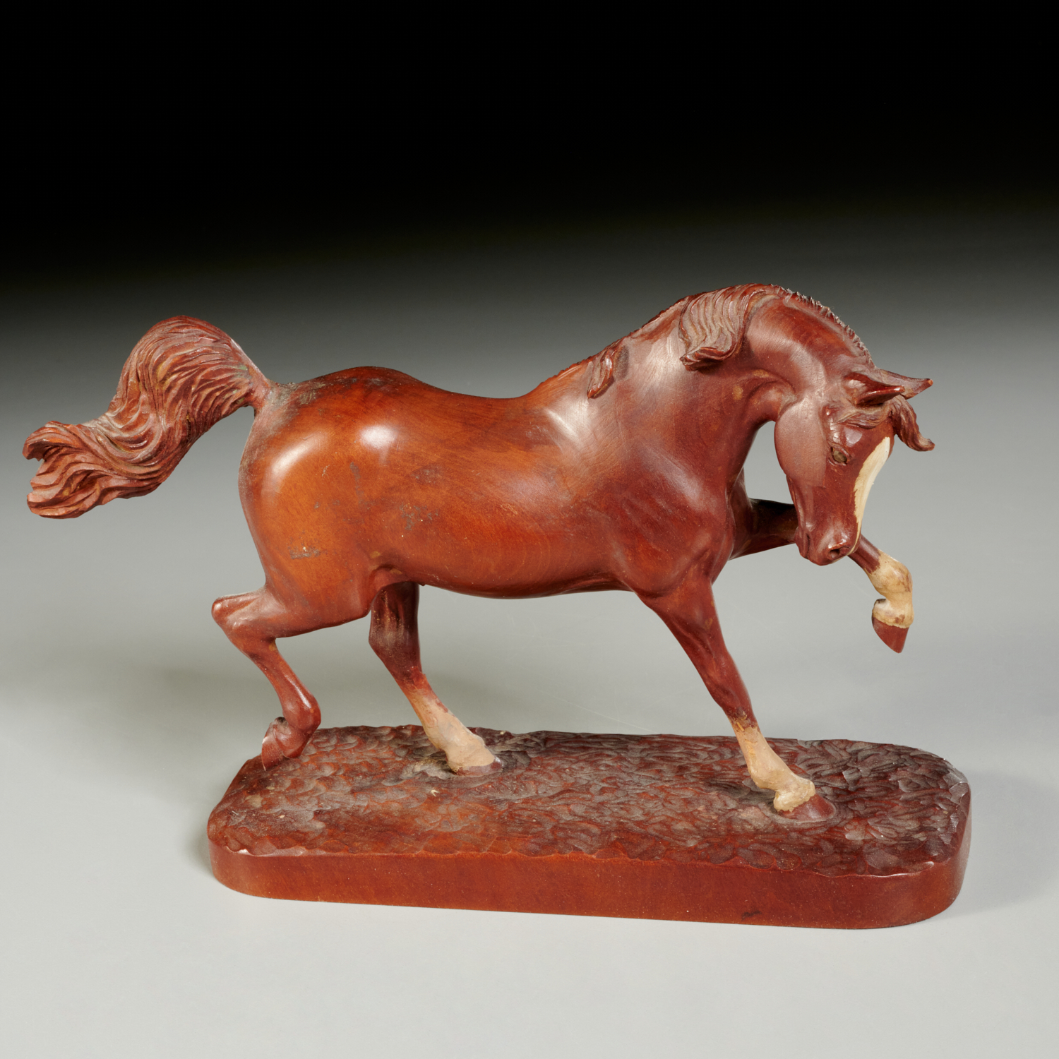 ARTIST-SIGNED CARVING OF A