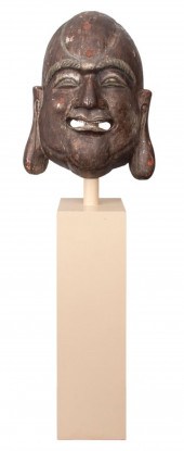 ASIAN BUDDHA MASK ON KARL SPRI