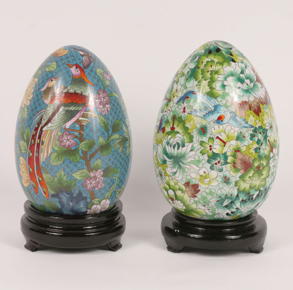 Asian cloisonne eggs on stands.