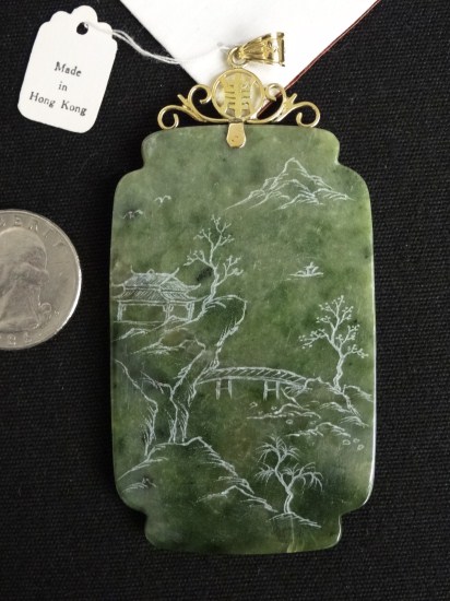 Asian jade pendent mounted in 14