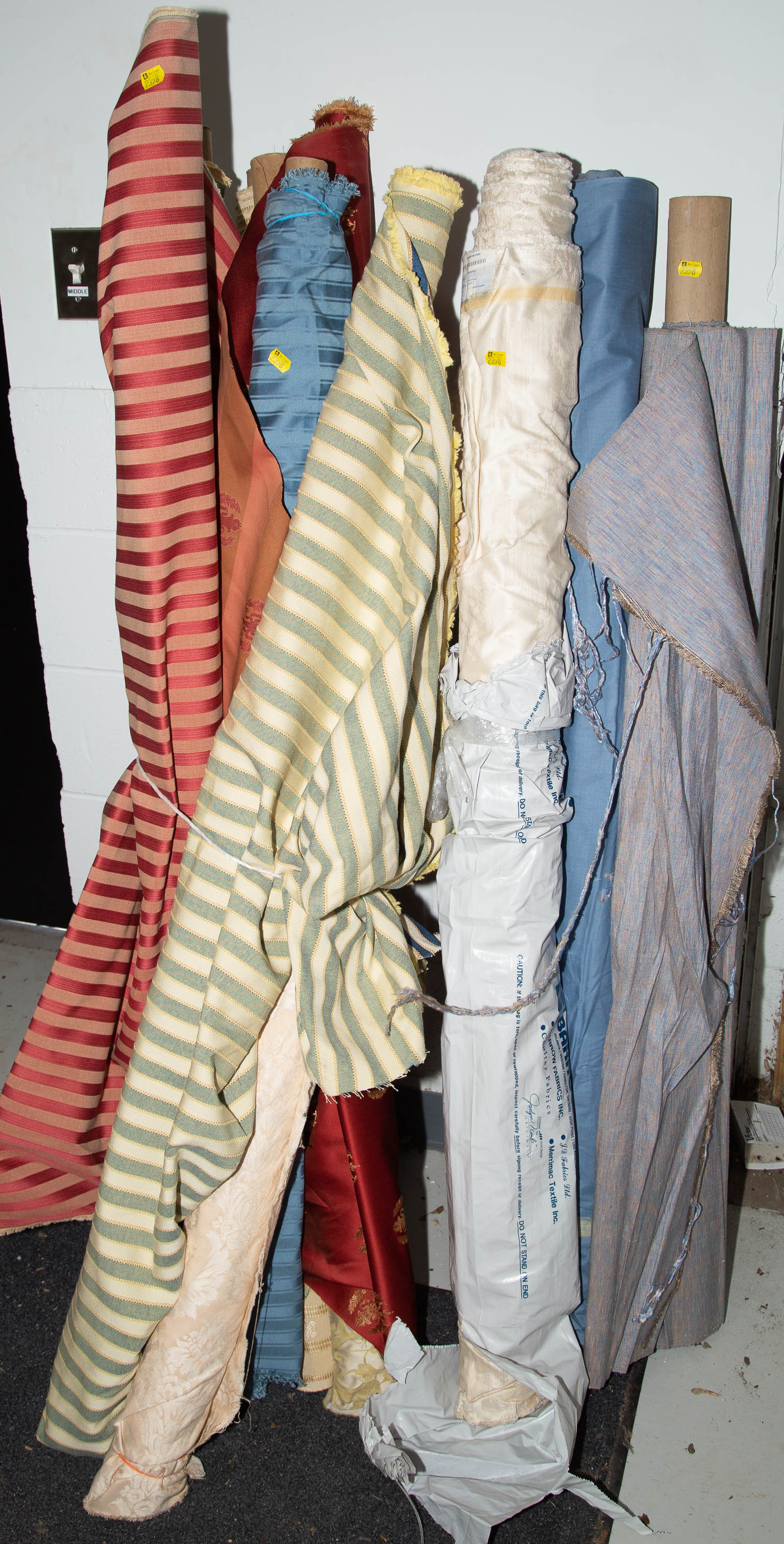 ASSORTED BOLTS OF FABRIC .