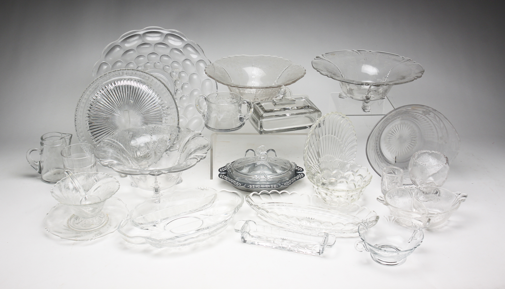ASSORTED HEISEY CLEAR GLASS PIECES.