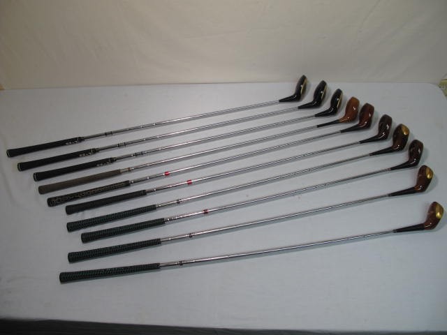 Assorted metal shaft golf clubs.