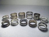Assorted silver napkin rings.
