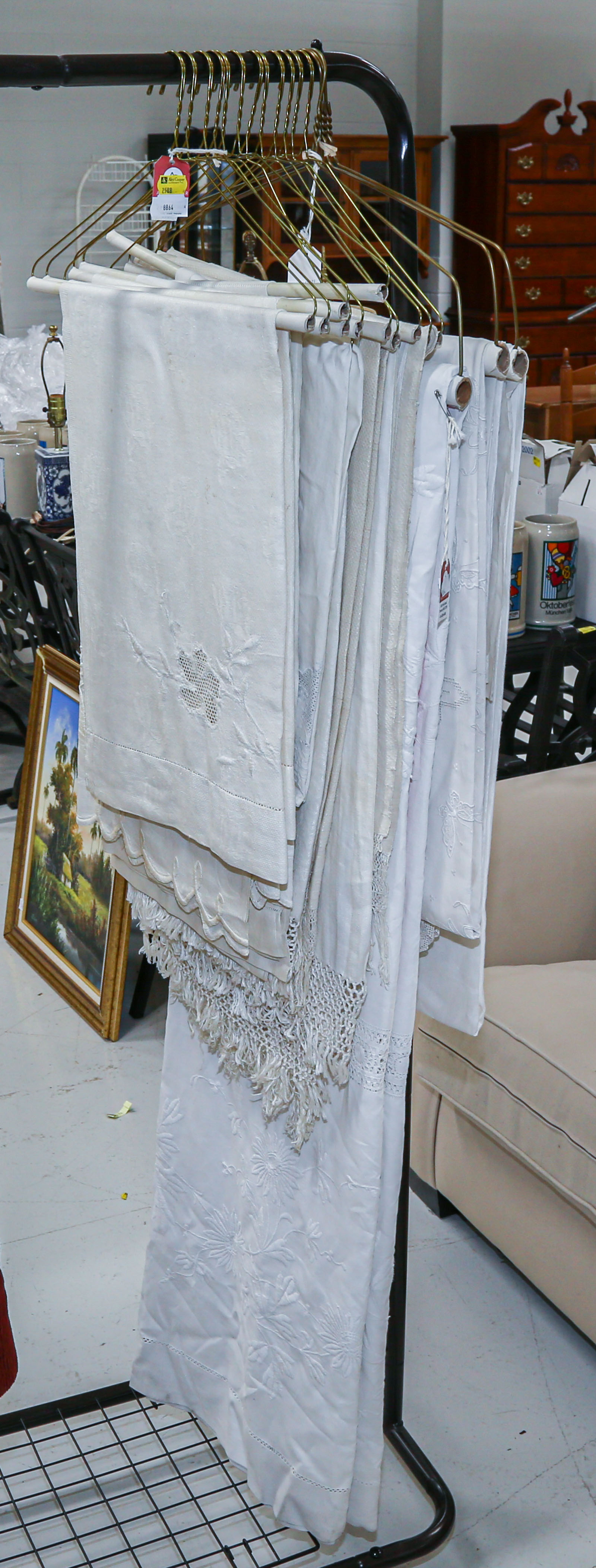 ASSORTMENT OF LINEN TABLE CLOTHS .