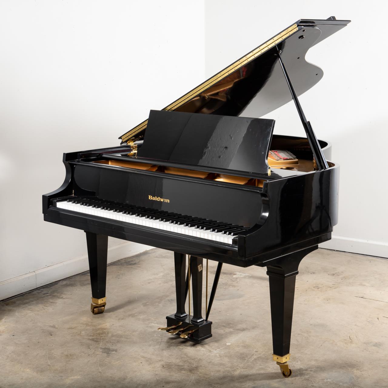 BALDWIN EBONIZED GRAND PIANO AND