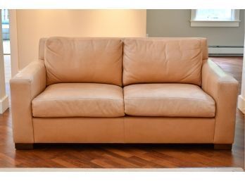 Beige or skin tone in color,