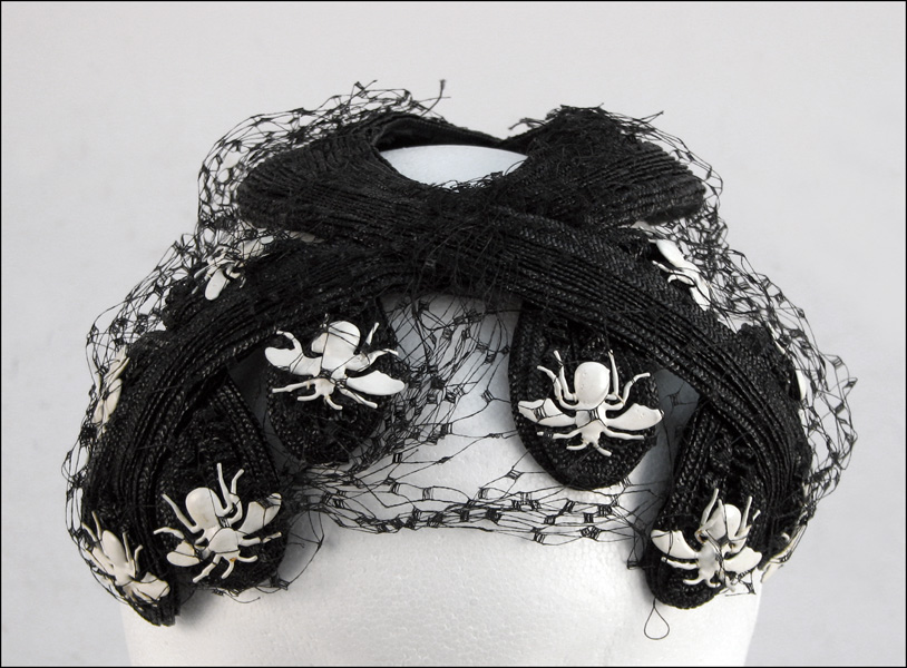 BES-BEN INSECTS ON BLACK STRAW HAT.