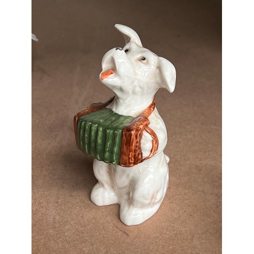 Beswick dog playing an accordion,