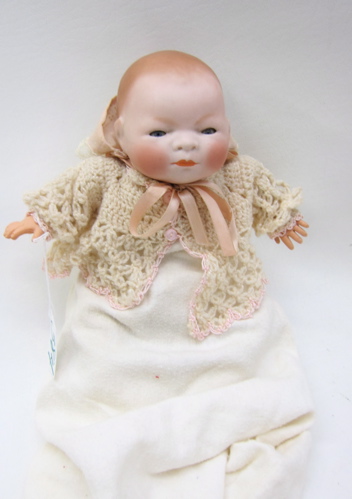 BISQUE HEAD BABY DOLL in the manner