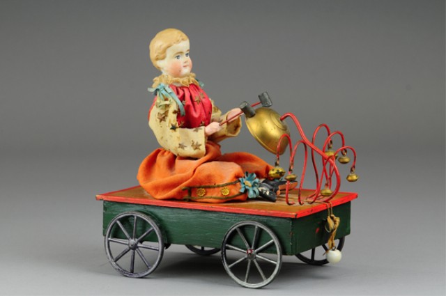 BISQUE HEAD DOLL BELL TOY