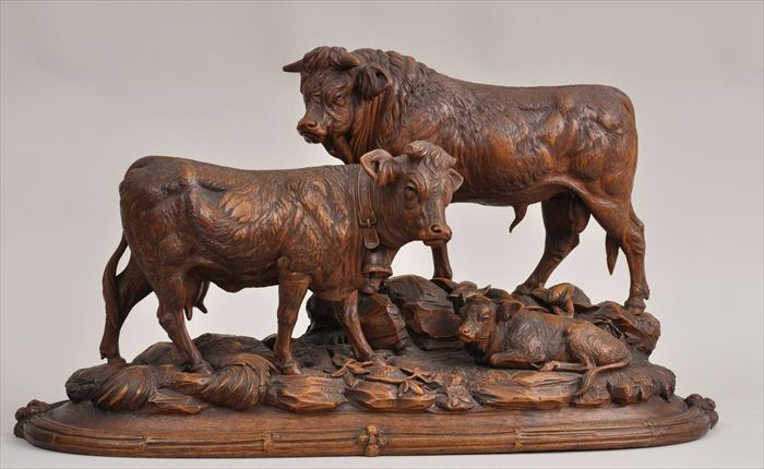 BLACK FOREST CARVED WALNUT BOVINE
