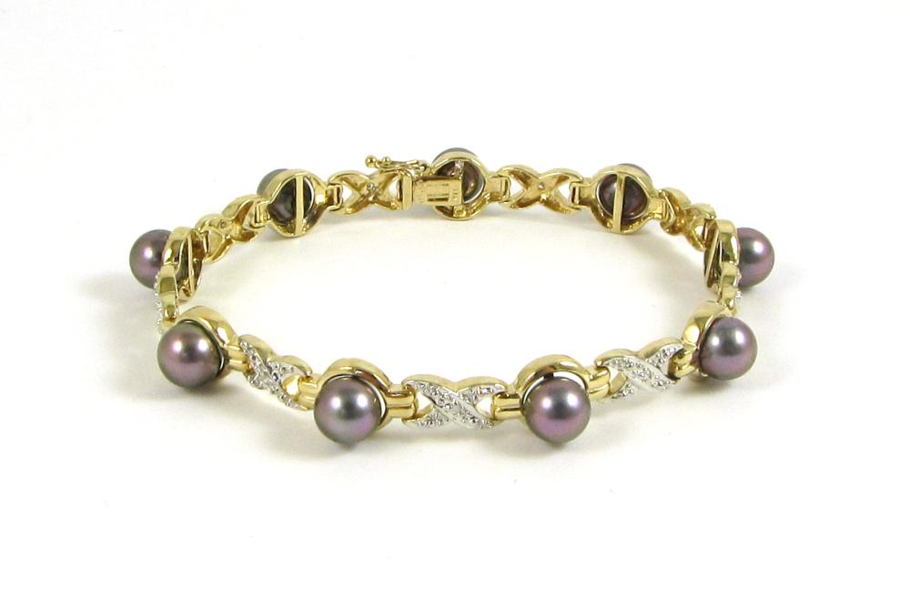 BLACK PEARL AND FOURTEEN KARAT GOLD