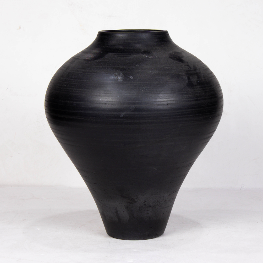 BLACKWARE VESSEL OF SHARPLY TAPERED