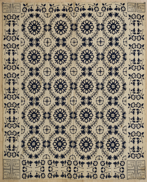 Blue and white jacquard coverlet