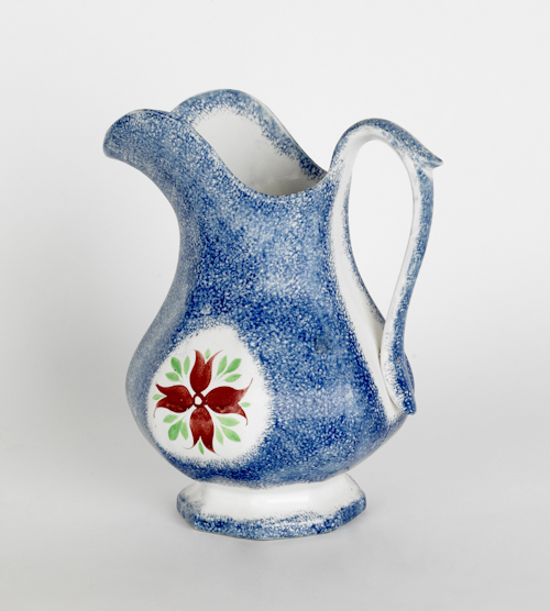 Blue spatter pitcher with a cluster