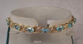BLUE TOPAZ AND FOURTEEN KARAT