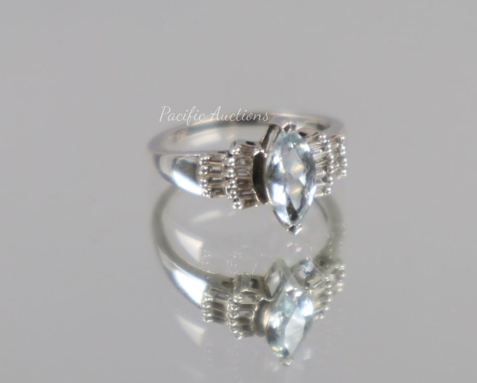 BLUE TOURMALINE AND TOPAZ RING,