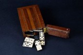 BONE AND EBONY DOMINOS IN CRIB