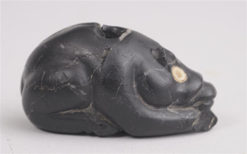 BONE-INLAID CARVED BLACK STONE