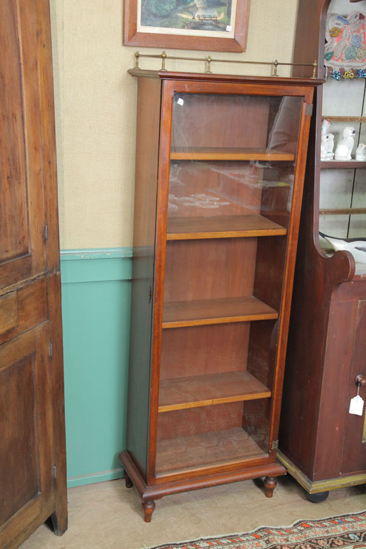 BOOKCASE. Dark stained walnut