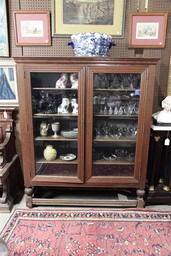 BOOKCASE. Oak having a molded