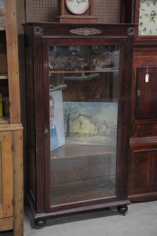 BOOKCASE. Oak with brass trim 