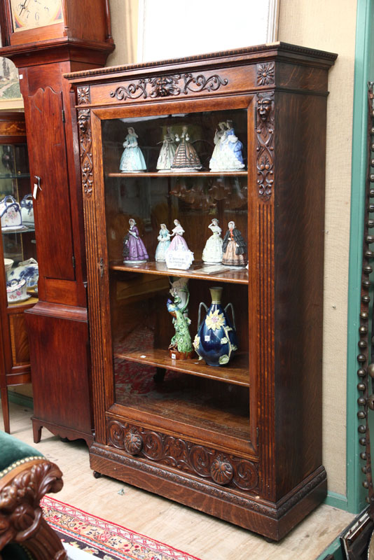 BOOKCASE. Oak with carved