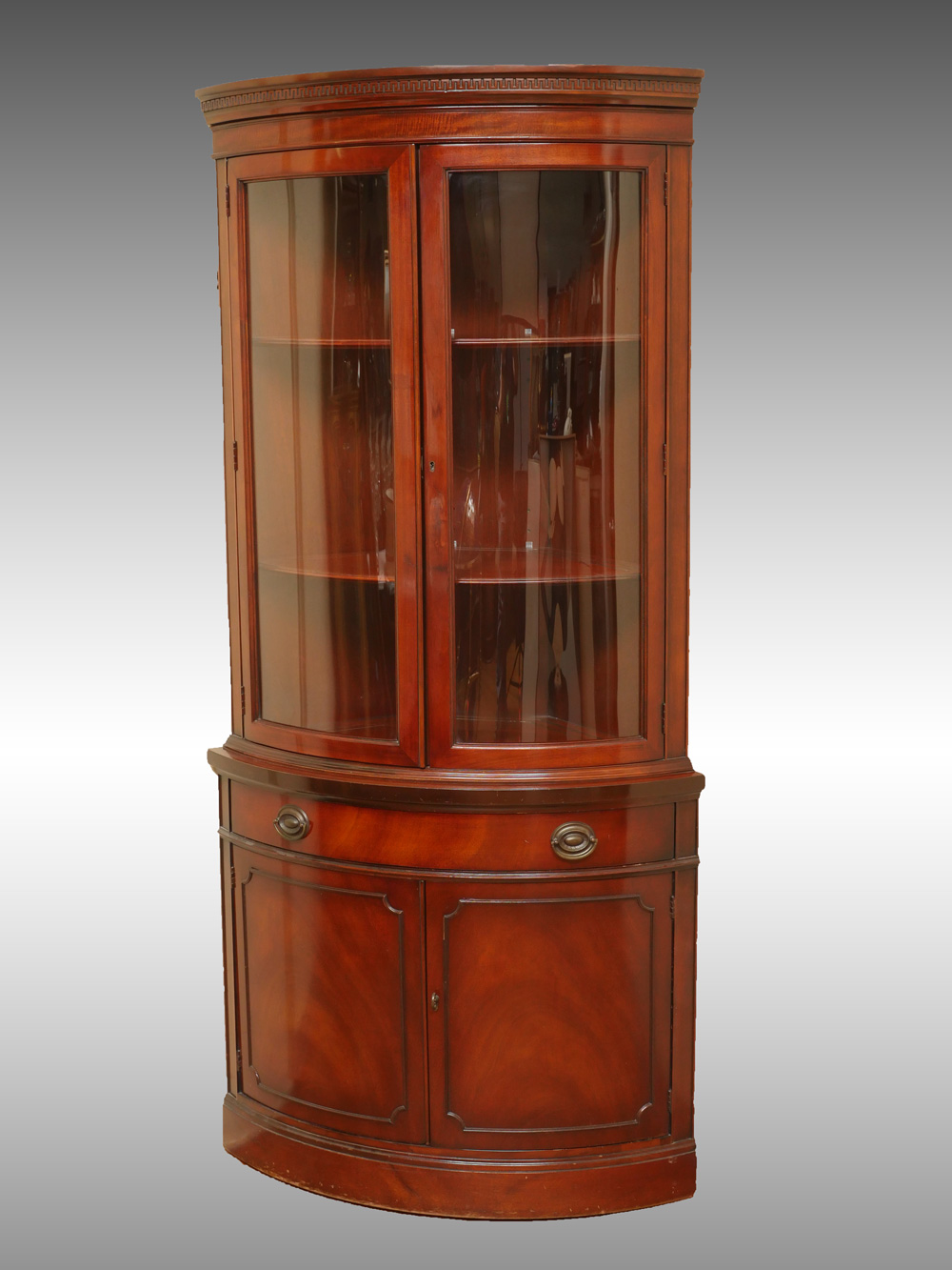 BOWFRONT MAHOGANY CORNER CABINET:
