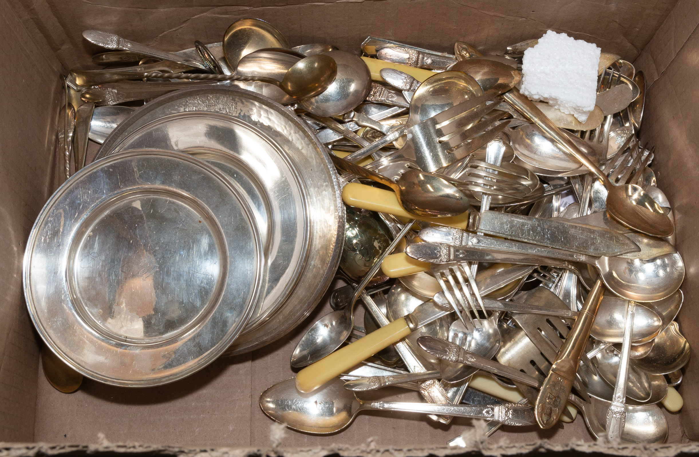 BOX OF ASSORTED SILVER PLATE .