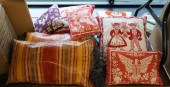 BOX OF EIGHT ASSORTED THROW PI