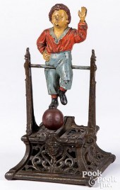 BOY ON TRAPEZE CAST IRON MECHA