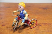 BOY ON TRICYCLE WIND-UP.  Firs
