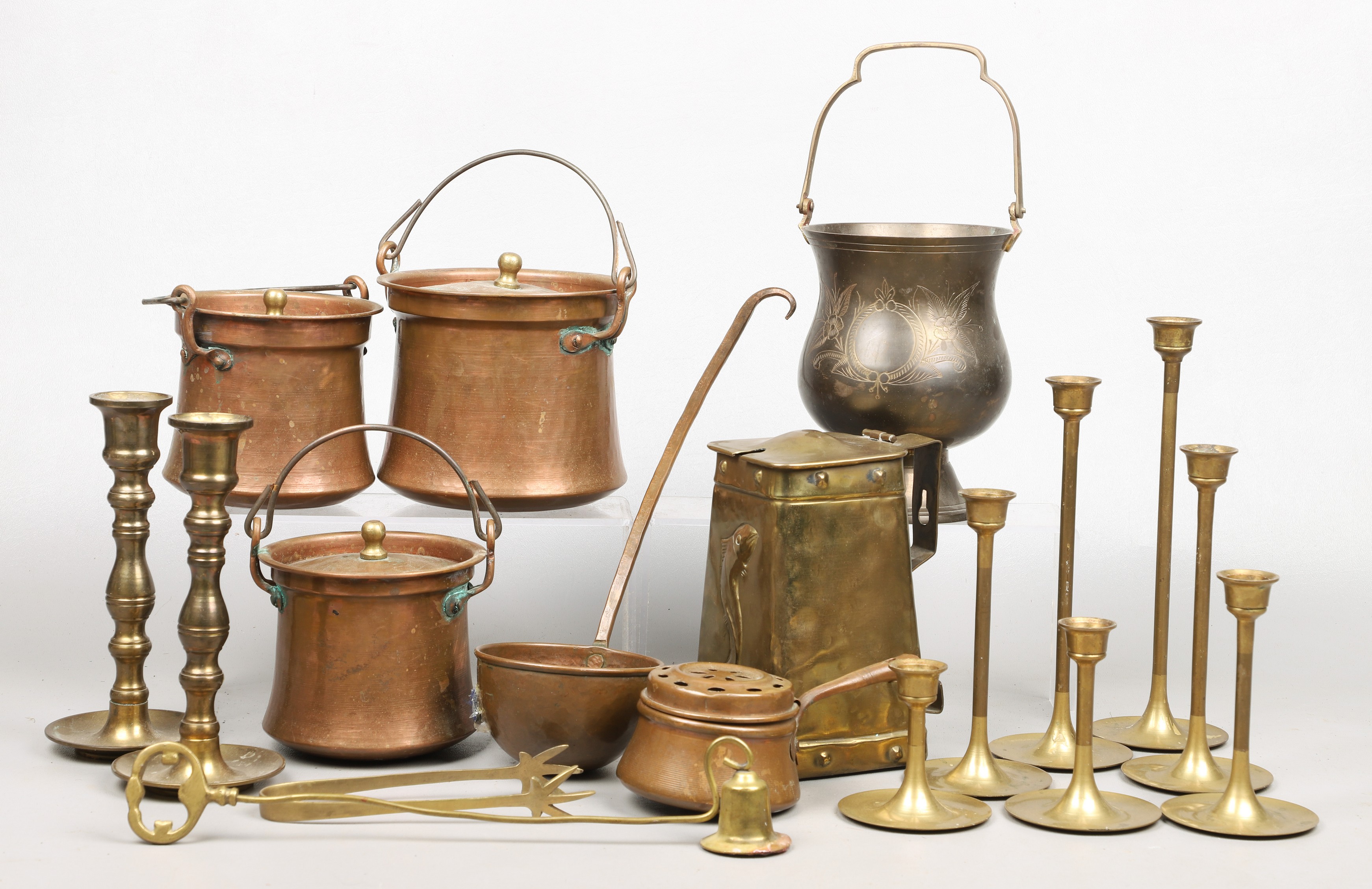 Brass and copper candlesticks,