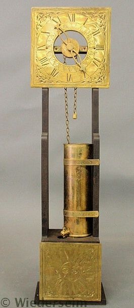 Brass and mahogany water clock with